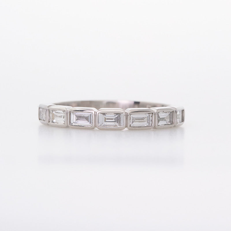 Platinum diamond baguette wedding band custom made with bezel set stones.
