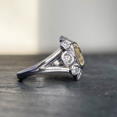 'Moon River' Platinum ring, 2.10CT cushion yellow sapphire bezel with 1.26TCW grey round brilliant diamond halo. Ring size 6.5