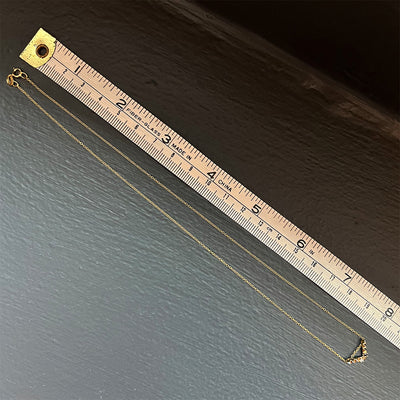 'Tender Love' Mini 'V' pendant, 14K yellow gold with black and white diamond. 16 inch cable chain, 12mm wide x 7mm long pendant