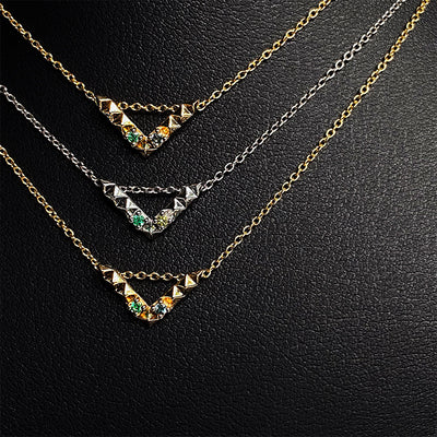 'Tender Love' Mini 'V' pendant, 14K yellow gold with black and white diamond. 16 inch cable chain, 12mm wide x 7mm long pendant