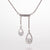 Heirloom diamond custom designed double drop from diamond bar pendant, set in white gold.
