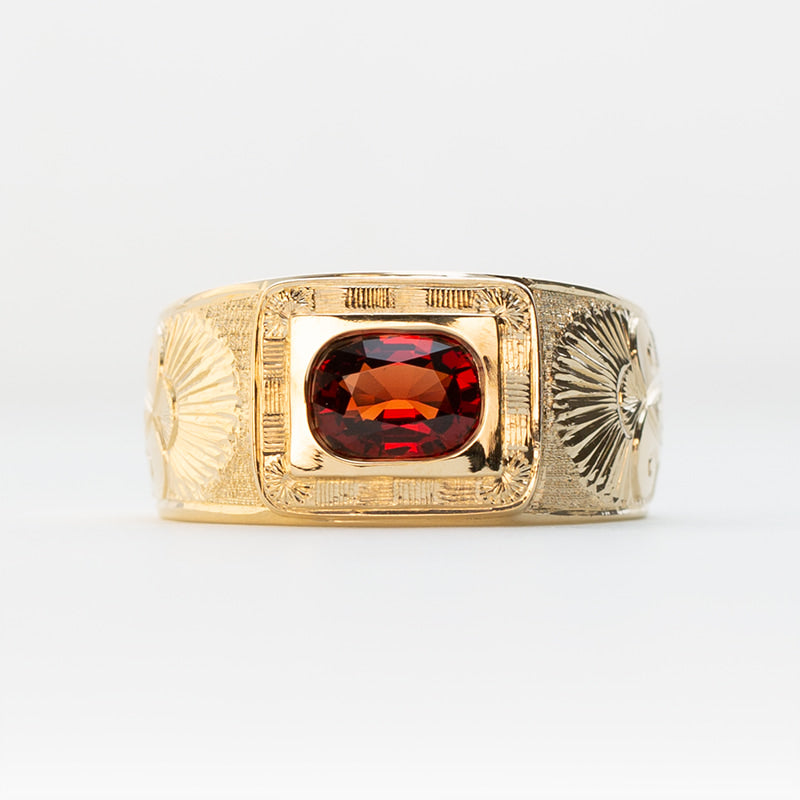 Men's custom yellow gold pinky ring featuring one carat cushion cut Red Spinel gemstone and hand engraving inspired by the Gates of Ishtar.