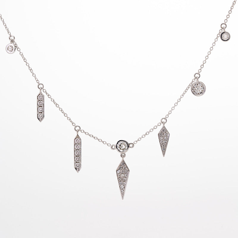 Sentimental diamonds repurposed into a custom bridal white gold diamond charm necklace.