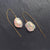 Baroque Iridescent Fresh Water Pearl drop earrings on 14K yellow gold chain threader. Pearls approximately 17mm L x 14mm W