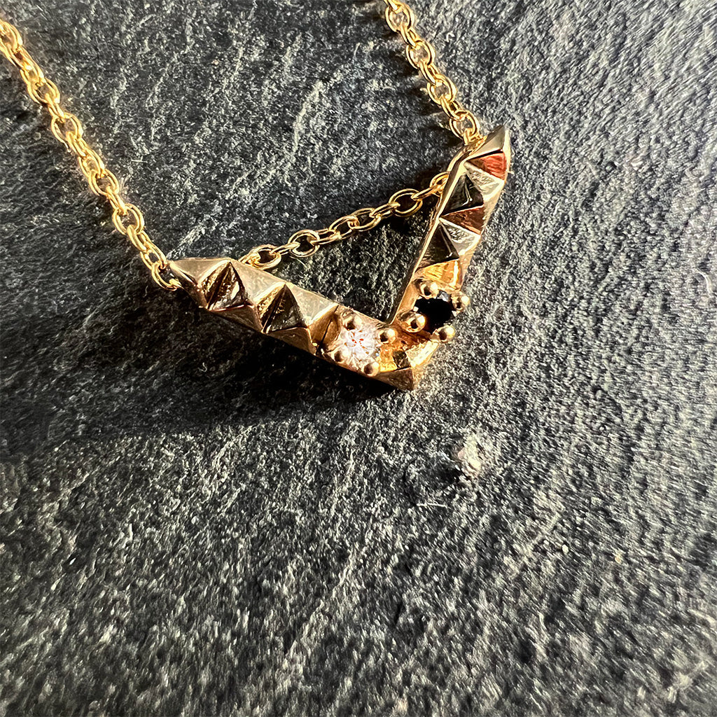 'Tender Love' Mini 'V' pendant, 14K yellow gold with black and white diamond. 16 inch cable chain, 12mm wide x 7mm long pendant